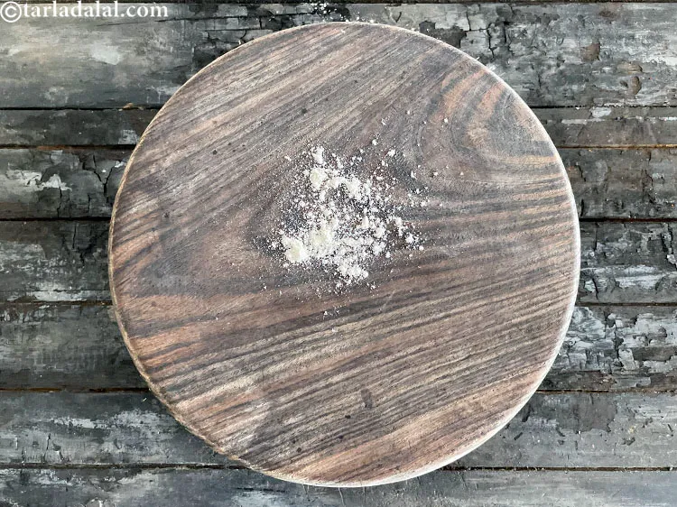 Step 37 – <html><head><meta charset="UTF-8"></head><body><p>Sprinkle a little flour on the rolling surface.&nbsp;</p></body></html>