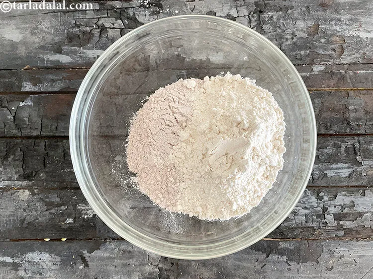 Step 12 – <html><head></head><body><p>Add&nbsp;1/2 cup&nbsp;<a href="glossary-whole-wheat-flour-gehun-ka-atta-gehun-ka-aata-429i">whole wheat flour (gehun ka atta)</a>.</p></body></html>