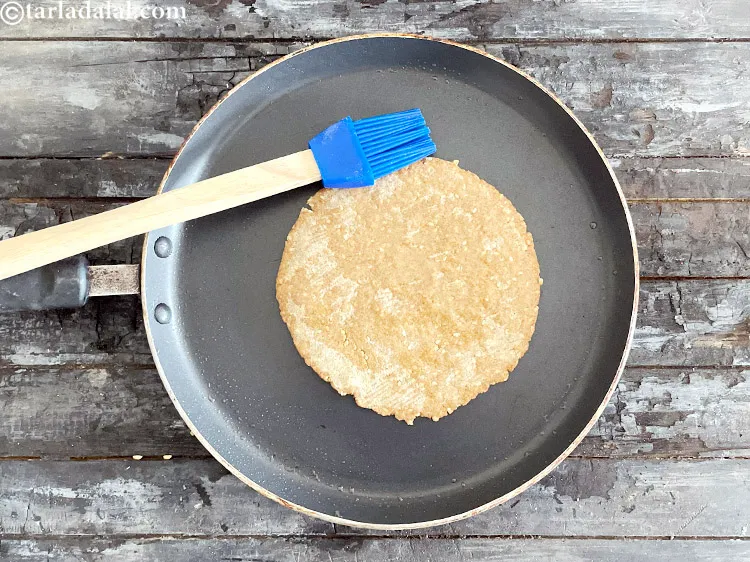 Step 30 – <p>Flip over and grease the khakhra with a brush.</p>