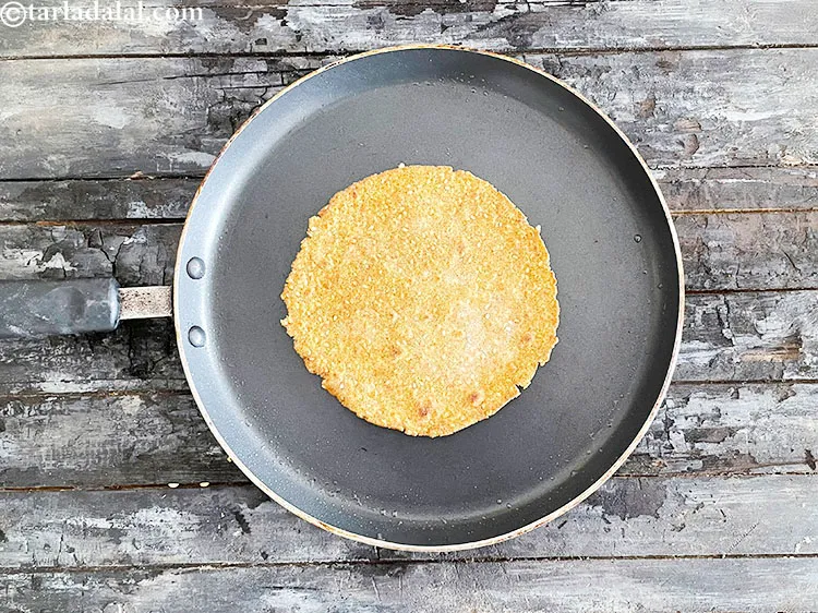 Step 31 – <p>Cook the bottom side of the khakhra.</p>