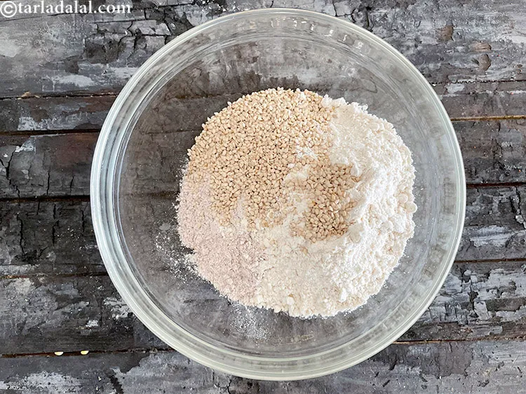 Step 13 – <html><head></head><body><p>Add&nbsp;2 tbsp&nbsp;<a href="glossary-roasted-sesame-seeds-2271i">roasted sesame seeds (til)</a>.</p></body></html>