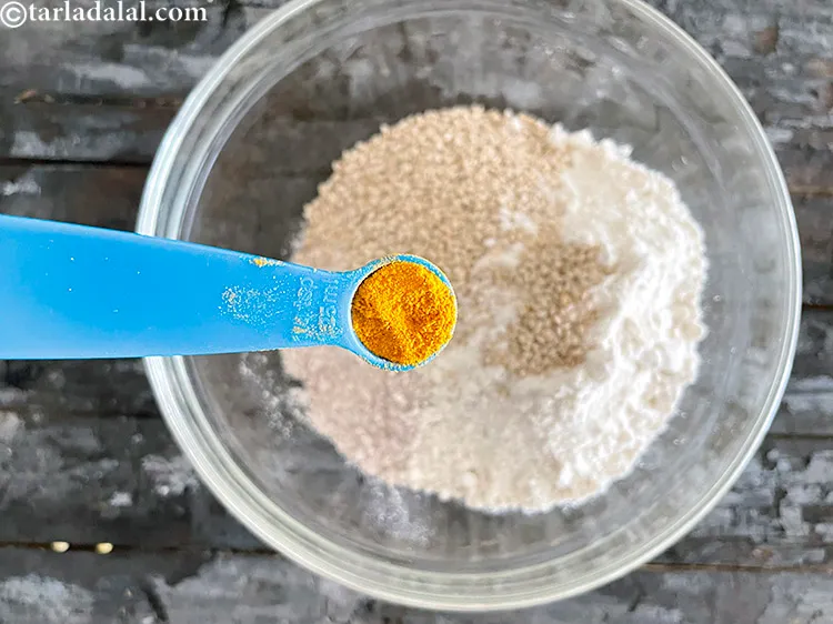 Step 14 – <html><head></head><body><p>Add&nbsp;1/4 tsp&nbsp;<a href="glossary-turmeric-powder-haldi-645i">turmeric powder (haldi)</a>.</p></body></html>