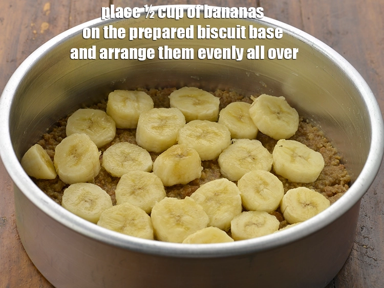 Step 7 – <p><span style="background-color:rgb(255,255,255);color:rgb(0,0,0);">Place ½ cup of </span><a href="https://www.tarladalal.com/glossary-banana-kela-17i#ing_2964"><u>sliced banana</u></a><span style="background-color:rgb(255,255,255);color:rgb(0,0,0);"> on the prepared biscuit base and …