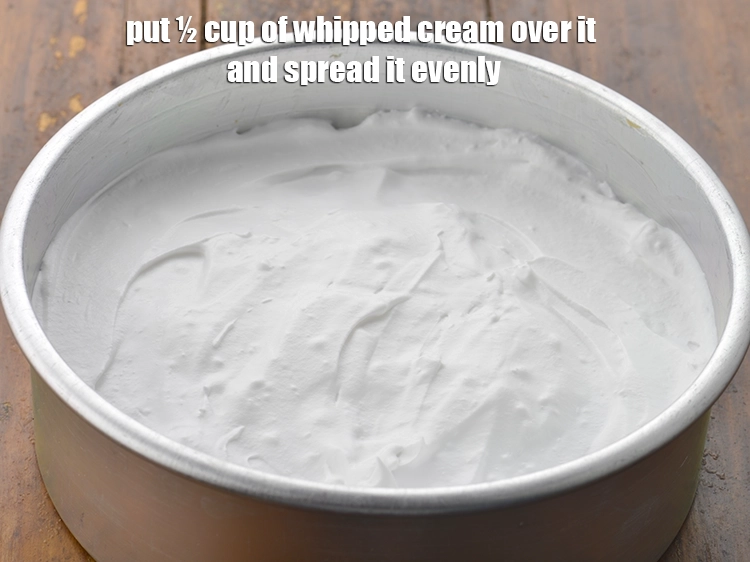 Step 9 – <p><span style="background-color:rgb(255,255,255);color:rgb(0,0,0);">Put ½ cup of </span><a href="https://www.tarladalal.com/glossary-beaten-whipped-cream-1948i"><u>beaten whipped cream</u></a><span style="background-color:rgb(255,255,255);color:rgb(0,0,0);"> over it and spread it …