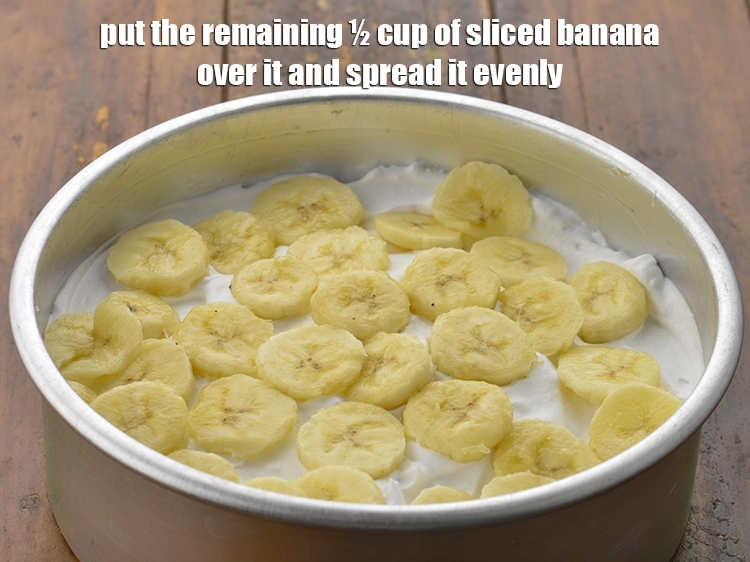 Step 10 – <p><span style="background-color:rgb(255,255,255);color:rgb(0,0,0);">Put the remaining ½ cup of </span><a href="https://www.tarladalal.com/glossary-banana-kela-17i#ing_2964"><u>sliced banana</u></a><span style="background-color:rgb(255,255,255);color:rgb(0,0,0);"> over it and spread …