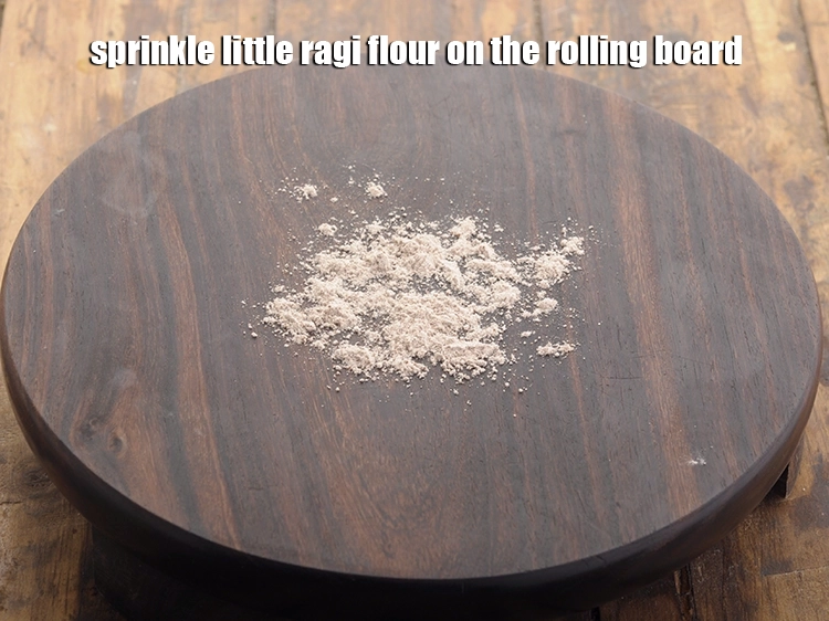 Step 10 – <p>Sprinkle little <a href="https://www.tarladalal.com/glossary-ragi-flour-nachni-flour-nachni-ka-atta-red-millet-flour-1115i"><u>ragi (nachni , red millet) flour</u></a> on the rolling board to avoid …