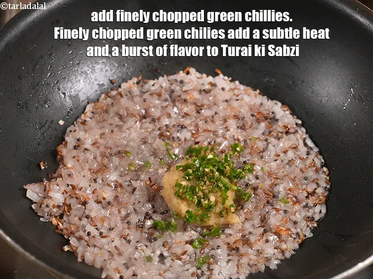 Step 9 – <p>Add 1 tsp finely&nbsp;<a href="https://www.tarladalal.com/glossary-chopped-green-chilli-820i">chopped green chillies</a>. Finely chopped green chilies add a subtle heat …