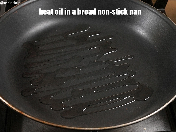 Step 5 – <p><span style="background-color:rgb(255,255,255);color:rgb(0,0,0);">Heat the 4 tbsp </span><a href="https://www.tarladalal.com/glossary-oil-671i"><u>oil</u></a><span style="background-color:rgb(255,255,255);color:rgb(0,0,0);"> in a broad non-stick pan.</span></p>