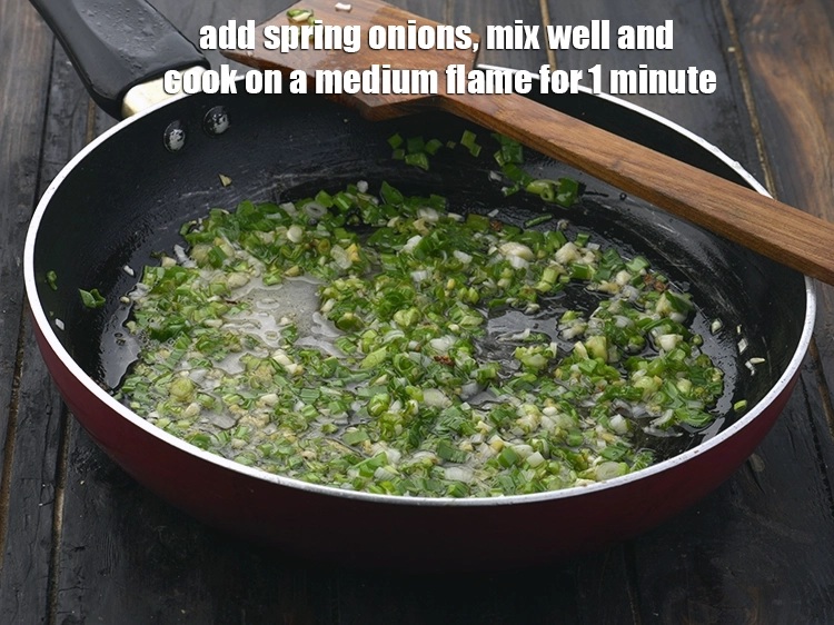 Step 9 – <p><span style="background-color:rgb(255,255,255);color:rgb(0,0,0);">Add the 1/2 cup </span><a href="https://www.tarladalal.com/glossary-spring-onion-hara-pyaz-443i#ing_2384"><u>chopped spring onions whites </u></a><span style="background-color:rgb(255,255,255);color:rgb(0,0,0);">and greens, mix well …
