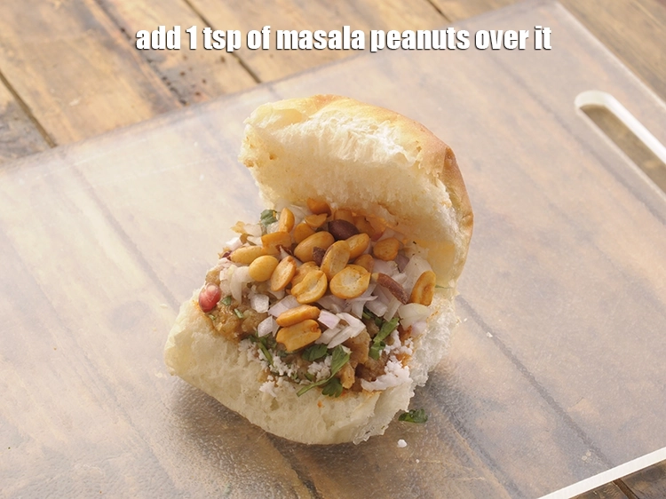 Step 22 – <p>Add 1 tsp of <a href="https://www.tarladalal.com/glossary-masala-peanuts-masala-sing-spicy-peanuts-1188i"><u>masala peanuts</u></a> over it.</p>