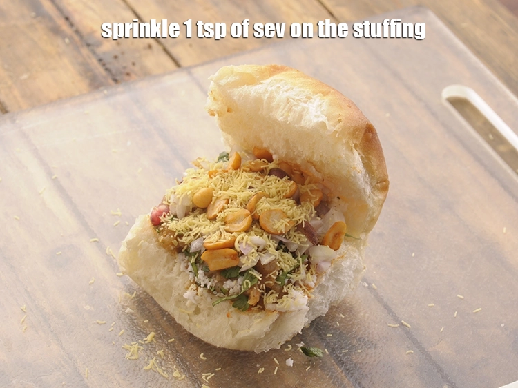 Step 23 – <p>Sprinkle 1 tsp of <a href="https://www.tarladalal.com/glossary-sev-1137i#ing_3489"><u>nylon sev</u></a> on the stuffing.</p>