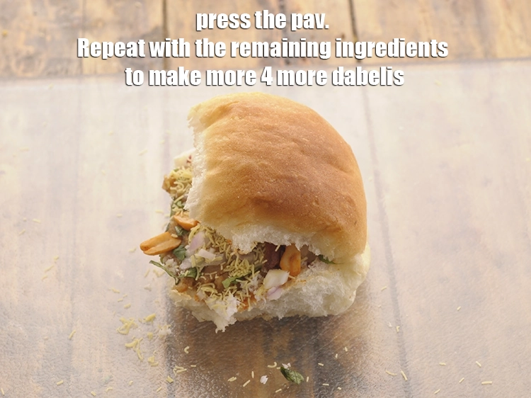 Step 24 – <p>Press the pav. Repeat with the remaining ingredients to make more 4 more dabelis.</p>