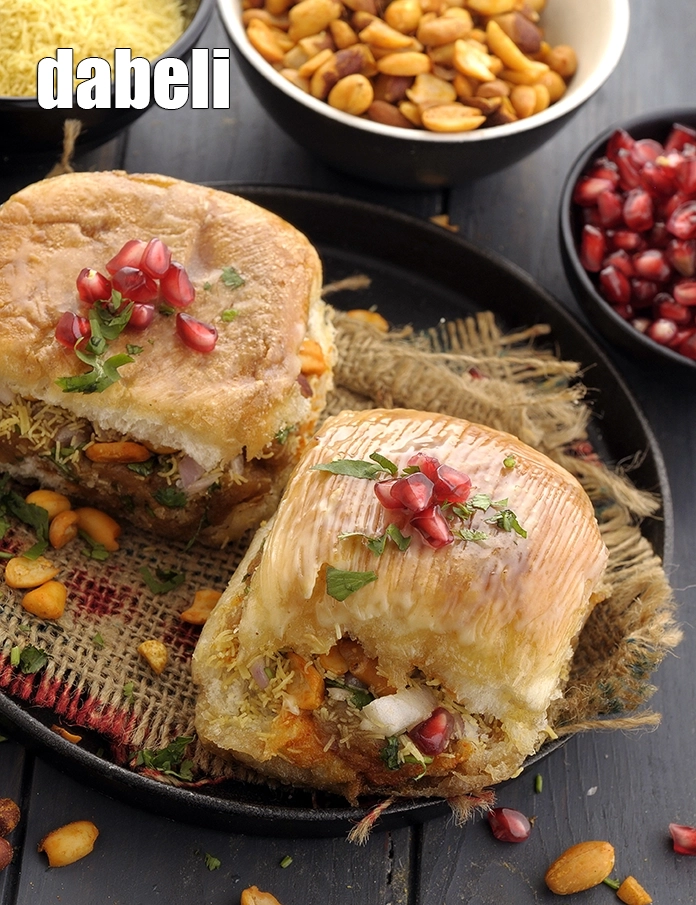 Step 44 – <p>Serve&nbsp;<strong>Dabeli (Mumbai Roadside Dabeli)</strong>&nbsp;hot.&nbsp;<strong>&nbsp;kutchii dabeli&nbsp;|&nbsp;double roti&nbsp;|</strong>&nbsp;lovers can try other deights like&nbsp;<a href="https://www.tarladalal.com/dabeli-cheese-fondue-41229r">Dabeli cheese fondue</a>&nbsp;and&nbsp;<a href="https://www.tarladalal.com/dabeli-bhajiya-40935r">Dabeli …