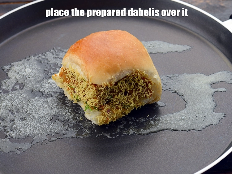 Step 40 – <p>Place the <strong>prepared dabelis</strong> over it.</p>