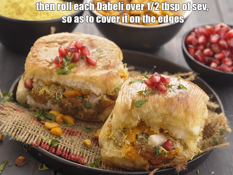 Step 46 – <p><span style="background-color:rgb(255,255,255);color:rgb(0,0,0);">Then roll each </span><strong>Dabeli (Mumbai Roadside Dabeli)</strong><span style="background-color:rgb(255,255,255);color:rgb(0,0,0);"> over 1/2 tbsp of sev, so …