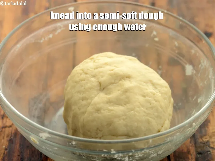 Step 5 – <p><span style="background-color:rgb(255,255,255);color:rgb(0,0,0);">Knead into a semi soft dough using enough <strong>water</strong>.</span></p>