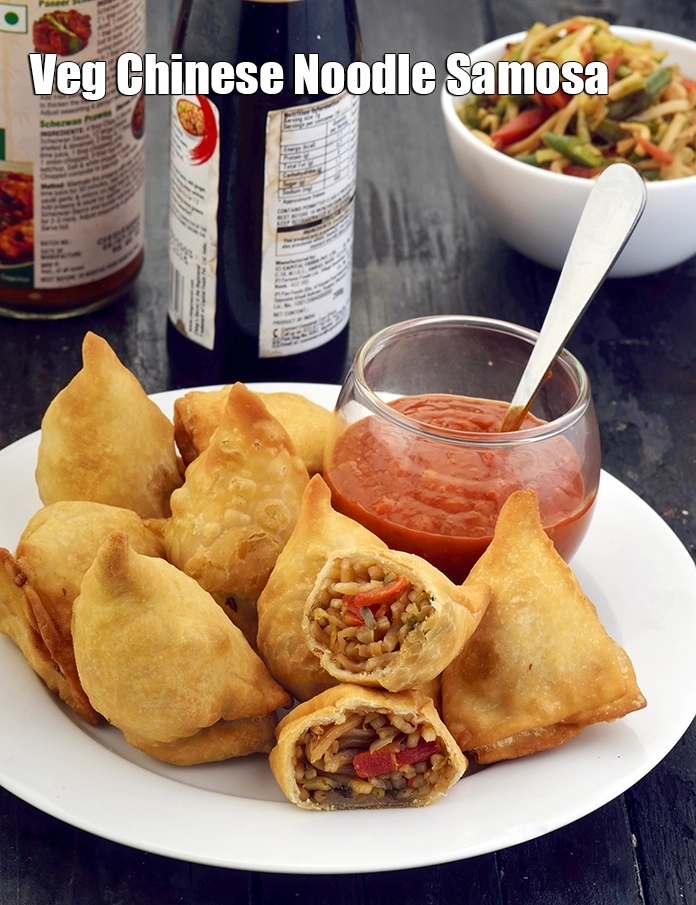 Step 18 – <p><span style="background-color:rgb(255,255,255);color:rgb(0,0,0);">Serve <strong>Chinese Samosa, Veg Chinese Noodle Samosa</strong> hot with </span><a href="https://www.tarladalal.com/glossary-Schezwan-sauce-Schezuan-sauce-1872i"><u>schezwan sauce</u></a><u>.</u></p>