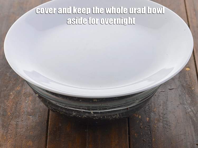 Step 2 – <p><span style="background-color:rgb(255,255,255);color:rgb(0,0,0);">Cover and keep the </span><a href="https://www.tarladalal.com/glossary-urad-whole-black-lentil-957i"><u>whole urad (whole black lentil)</u></a><span style="background-color:rgb(255,255,255);color:rgb(0,0,0);"> bowl aside for …