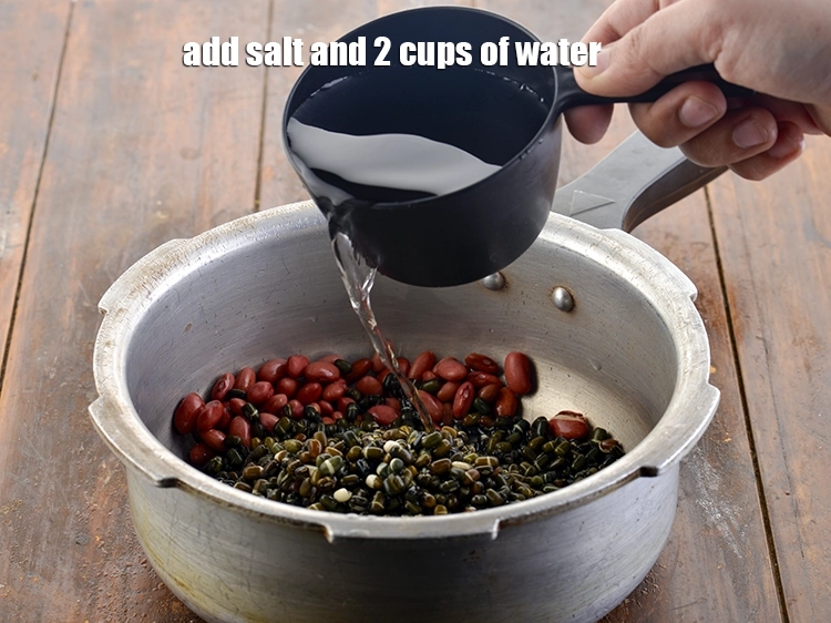 Step 8 – <p>Add 2 cups of <strong>water</strong> and <a href="https://www.tarladalal.com/glossary-salt-namak-table-salt-418i"><u>salt</u></a>.</p>