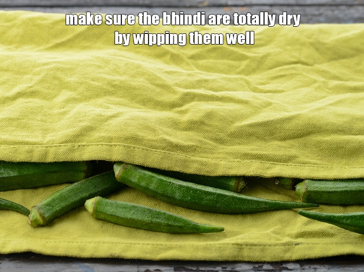 Step 6 – <p>Make sure the bhindi are totally dry by wipping them well.&nbsp;</p>
