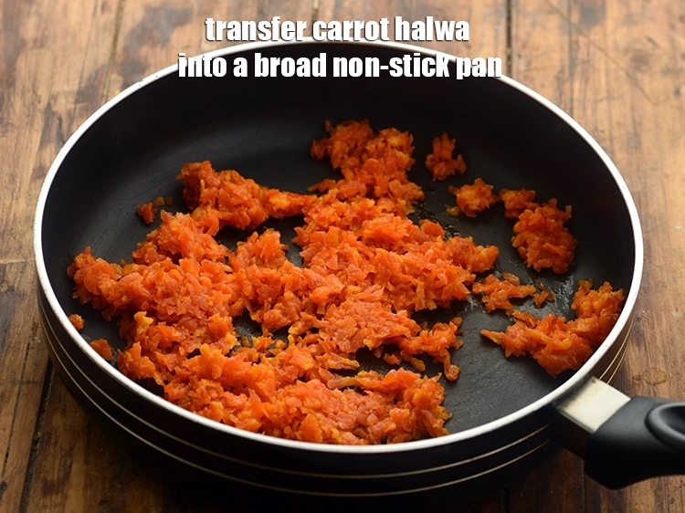 Step 11 – <p>Transfer <strong>carrot halwa</strong> into a broad non-stick pan. It looks slightly gooey with little milk …