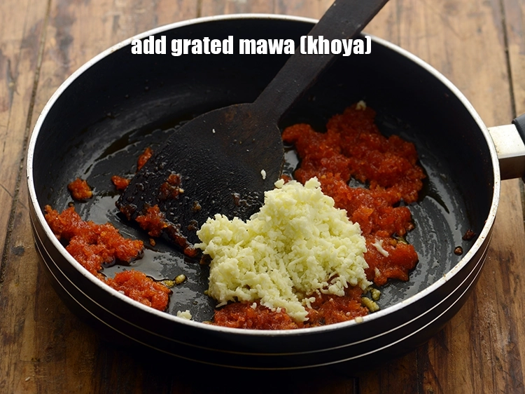 Step 14 – <p>Add <span style="background-color:rgb(255,255,255);color:rgb(0,0,0);">4 tbsp </span><a href="https://www.tarladalal.com/glossary-mawa-khoya-mava-490i#ing_3112"><u>grated mawa (khoya)</u></a> to make instant <strong>gajar ka halwa</strong> rich. …