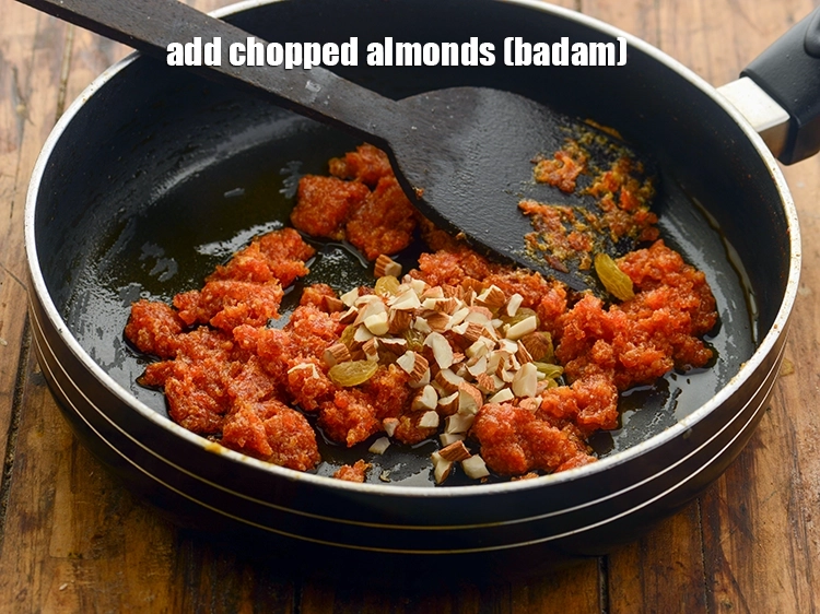 Step 17 – <p>Add <span style="background-color:rgb(255,255,255);color:rgb(0,0,0);">1 tbsp </span><a href="https://www.tarladalal.com/glossary-almonds-badam-378i#ing_3231"><u>chopped almonds (badam)</u></a>. If you like crunchy nuts, then roast …