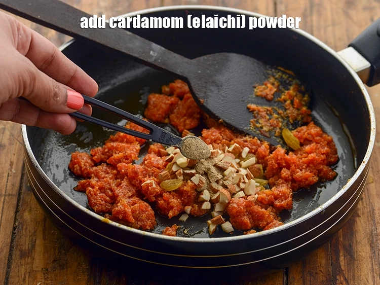 Step 18 – <p>Add <span style="background-color:rgb(255,255,255);color:rgb(0,0,0);">1/2 tsp </span><a href="https://www.tarladalal.com/glossary-cardamom-powder-elaichi-powder-265i"><u>cardamom (elaichi) powder</u></a> to enhance the flavor and make carrot …
