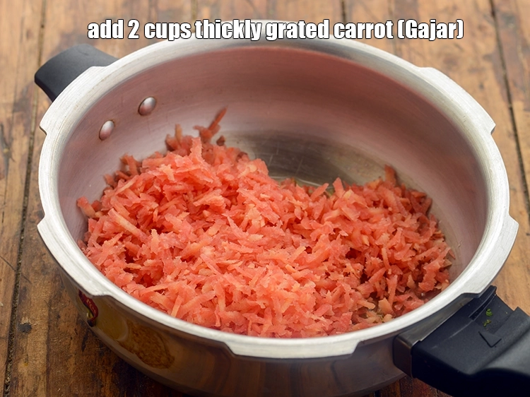 Step 5 – <p>Add the <span style="background-color:rgb(255,255,255);color:rgb(0,0,0);">2 cups thickly </span><a href="https://www.tarladalal.com/glossary-carrot-gajar-gajjar-253i#ing_2385"><u>grated carrot</u></a>.</p>