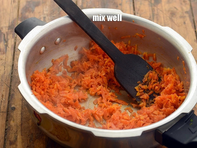 Step 8 – <p>Mix well. Traditionally, <strong>gajar ka halwa</strong> is made in a thick kadhai by reducing the …