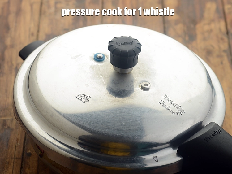 Step 9 – <p>Pressure cook <strong>gajrela</strong> for 1 whistle.</p>