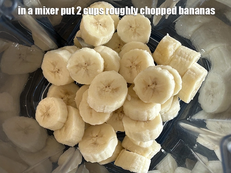 Step 1 – <p><span style="background-color:rgb(255,255,255);color:rgb(0,0,0);">To make <strong>Banana Milkshake</strong>, in a mixer put 2 cups roughly </span><a href="https://www.tarladalal.com/glossary-banana-kela-17i#ing_2965"><u>chopped bananas</u></a><u>.</u></p>