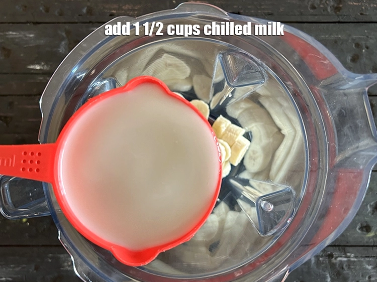 Step 2 – <p><span style="background-color:rgb(255,255,255);color:rgb(0,0,0);">1 1/2 cups chilled </span><a href="https://www.tarladalal.com/glossary-milk-doodh-full-cream-milk-514i"><u>milk</u></a><u>. and </u><span style="background-color:rgb(255,255,255);color:rgb(0,0,0);">2 tbsp </span><a href="https://www.tarladalal.com/glossary-sugar-chini-shakkar-278i"><u>sugar</u></a><u>.</u></p>