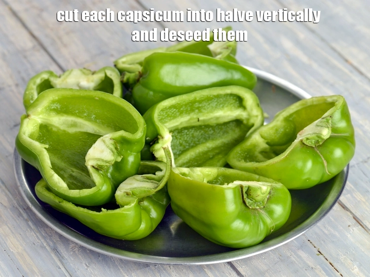 Step 12 – <p><span style="background-color:rgb(255,255,255);color:rgb(0,0,0);">Cut the stem of all the 4 big </span><a href="https://www.tarladalal.com/glossary-capsicum-shimla-mirch-bell-pepper-163i"><u>capsicum</u></a><span style="background-color:rgb(255,255,255);color:rgb(0,0,0);">. Cut each capsicum …