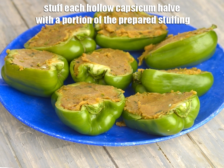 Step 13 – <p><span style="background-color:rgb(255,255,255);color:rgb(0,0,0);"><strong>Stuff</strong> each hollow capsicum halve with a portion of the <strong>prepared stuffing</strong>. Keep aside.</span></p>