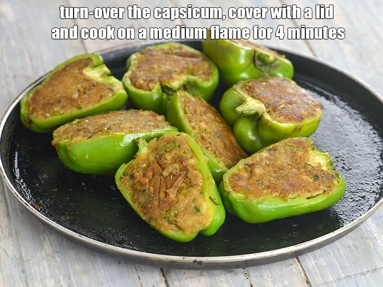 Step 17 – <p><span style="background-color:rgb(255,255,255);color:rgb(0,0,0);">Turn-over the capsicum, cover with a lid and cook on a medium flame for …