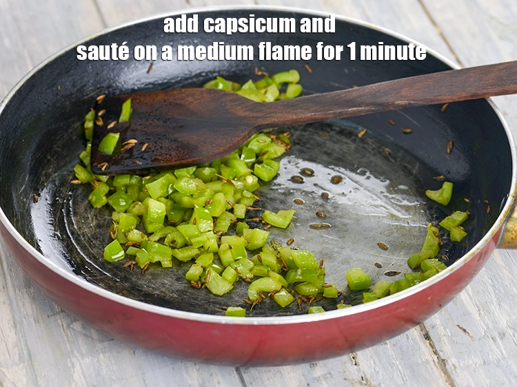 Step 8 – <p><span style="background-color:rgb(255,255,255);color:rgb(0,0,0);">When the seeds crackle, add the 1/2 cup </span><a href="https://www.tarladalal.com/glossary-capsicum-shimla-mirch-bell-pepper-163i#ing_2311"><u>chopped capsicum</u></a><span style="background-color:rgb(255,255,255);color:rgb(0,0,0);"> and sauté …