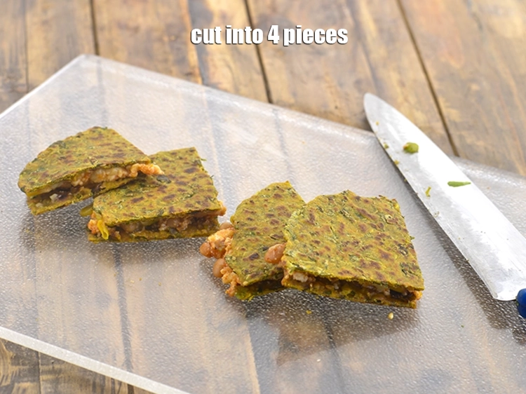 Step 23 – <p><span style="background-color:rgb(255,255,255);color:rgb(0,0,0);">Cut <strong>thepla</strong> into 4 pieces.</span></p>