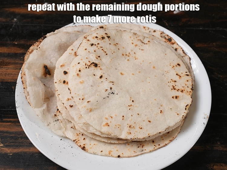 Step 25 – <p>Repeat with the remaining dough portions to make 7 more <strong>rotis</strong>.</p>