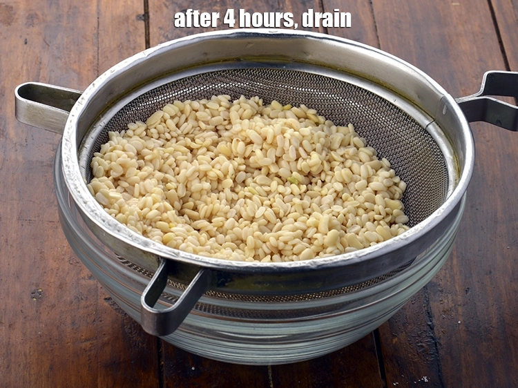 Step 10 – <p>After 4 hours, <strong>urad dal (split black lentils)</strong> drain.</p>