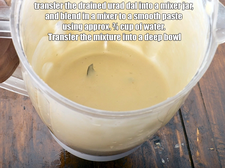 Step 11 – <p>Transfer the drained <span style="background-color:rgb(255,255,255);color:rgb(0,0,0);"><strong>urad dal</strong></span> into a mixer jar <span style="background-color:rgb(255,255,255);color:rgb(0,0,0);">and blend in a …