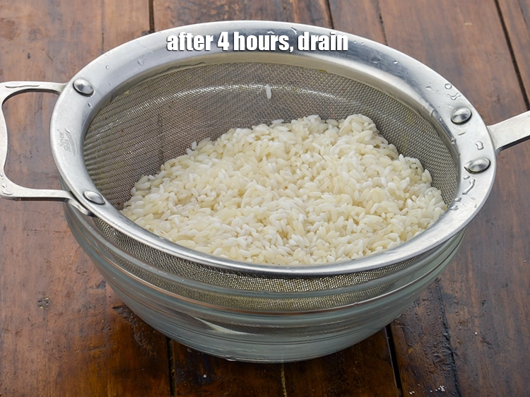 Step 12 – <p>After 4 hours, <span style="background-color:rgb(255,255,255);color:rgb(0,0,0);"><strong>par-boiled rice and raw rice</strong> </span>drain.</p>