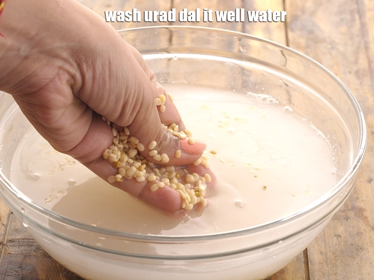 Step 2 – <p>Wash <strong>urad dal</strong> it well water and drain it</p>