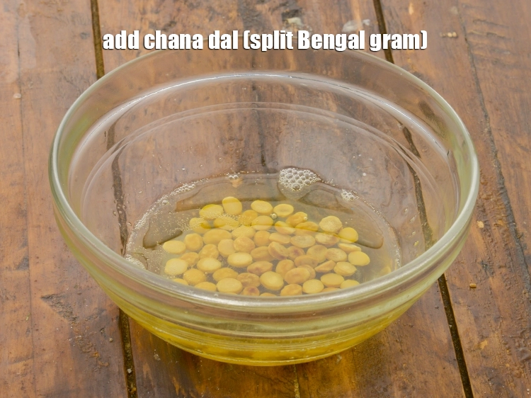 Step 20 – <p><span style="background-color:rgb(255,255,255);color:rgb(0,0,0);">Add the 1/2 tbsp </span><a href="https://www.tarladalal.com/glossary-chana-dal-split-Bengal-gram-285i"><u>chana dal (split Bengal gram)</u></a><u>.</u></p>