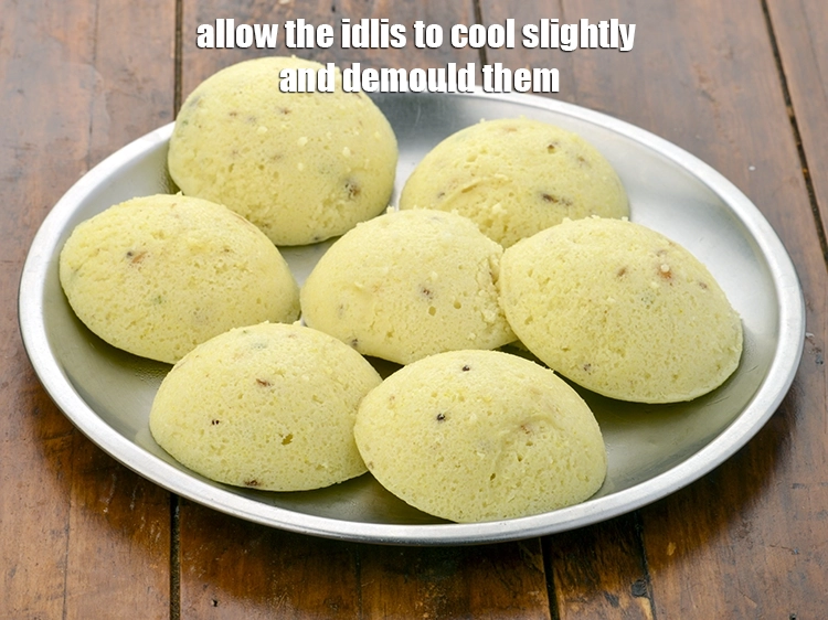 Step 25 – <p><span style="background-color:rgb(255,255,255);color:rgb(0,0,0);">Allow the <strong>idlis</strong> to cool slightly and demould them.</span></p>