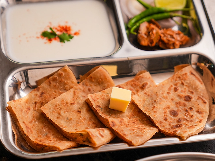 Step 29 – <p><strong>Aloo parathas</strong>&nbsp;can be enjoyed for&nbsp;<a href="https://www.tarladalal.com/recipes-for-Breakfast-Theplas-Parathas-432">breakfast</a>,&nbsp;<a href="https://www.tarladalal.com/recipes-for-Parathas-for-Lunch-928">lunch</a>&nbsp;as well as dinner. Instead of curds,&nbsp;<a href="https://www.tarladalal.com/recipes-for-Stuffed-Parathas-Collection-Veg-Stuffed-Parathas-201">stuffed parathas</a>&nbsp;can …