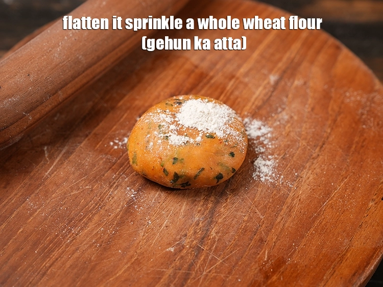 Step 20 – <html><head><meta charset="UTF-8"></head><body><p>Flatten it and <span style="background-color:rgb(255,255,255);color:rgb(0,0,0);">Dust it with </span><a href="https://www.tarladalal.com/glossary-whole-wheat-flour-gehun-ka-atta-gehun-ka-aata-429i"><u>whole wheat flour (gehun ka atta)</u></a><span …