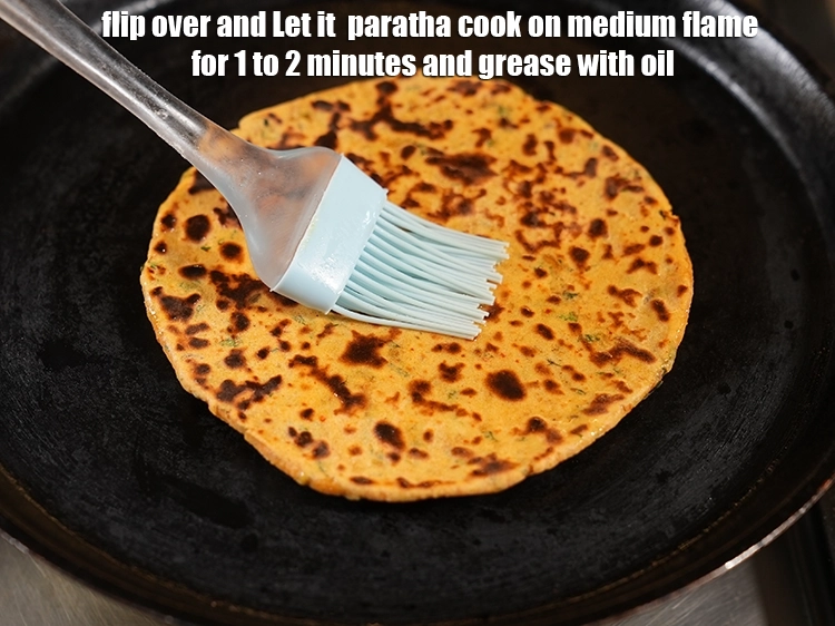 Step 27 – <p>Let it &nbsp;<strong>paratha</strong> cook on medium flame for 1 to 2 minutes&nbsp;and grease with <a …
