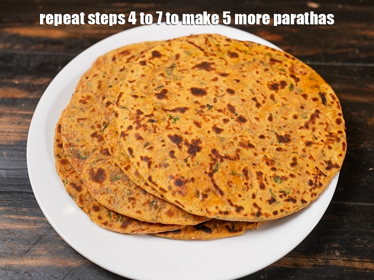 Step 31 – <p><span style="background-color:rgb(255,255,255);color:rgb(0,0,0);">Repeat steps 4 to 7 to make 5 more <strong>parathas</strong>.</span></p>