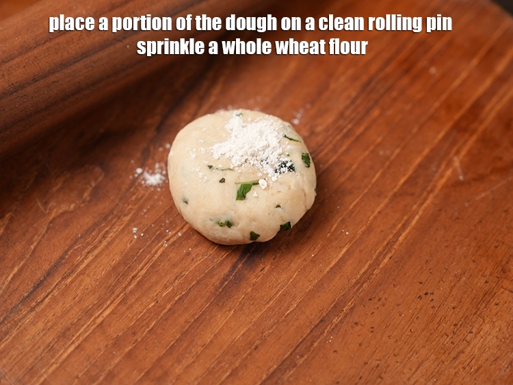 Step 18 – <p>Place a portion of the <strong>dough</strong> on a clean rolling pin sprinkle a <a href="https://www.tarladalal.com/glossary-whole-wheat-flour-gehun-ka-atta-gehun-ka-aata-429i"><u>whole …